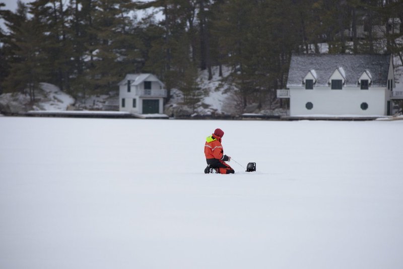 Image: Experience the Thrill of Ice Fishing in Canada's Chilling Winter Wonderland